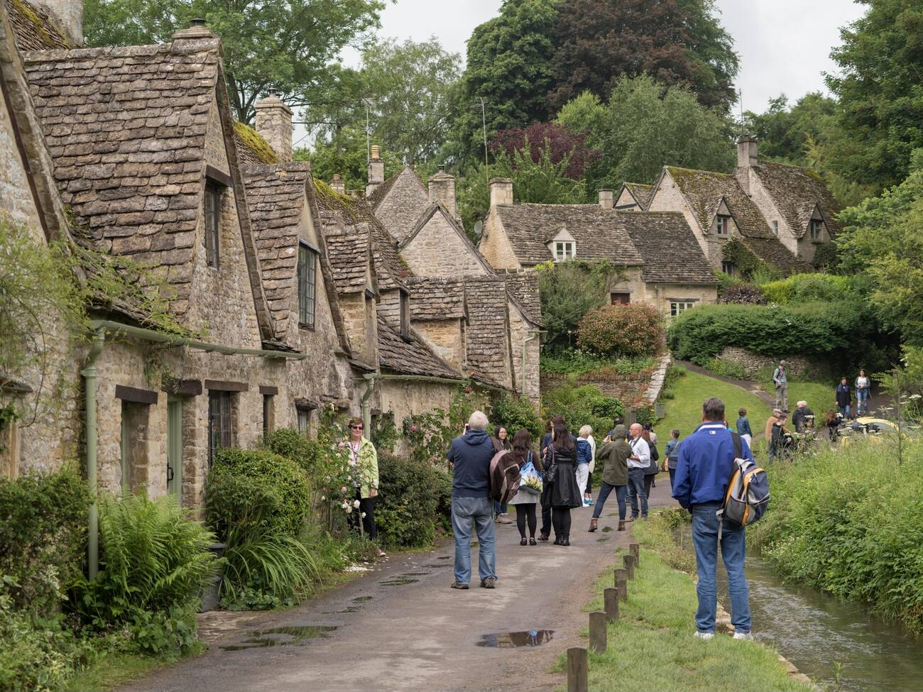 Beautiful cottages at Arlington Row in Cotswolds village of Bibury, Gloucestershire, United Kingdom